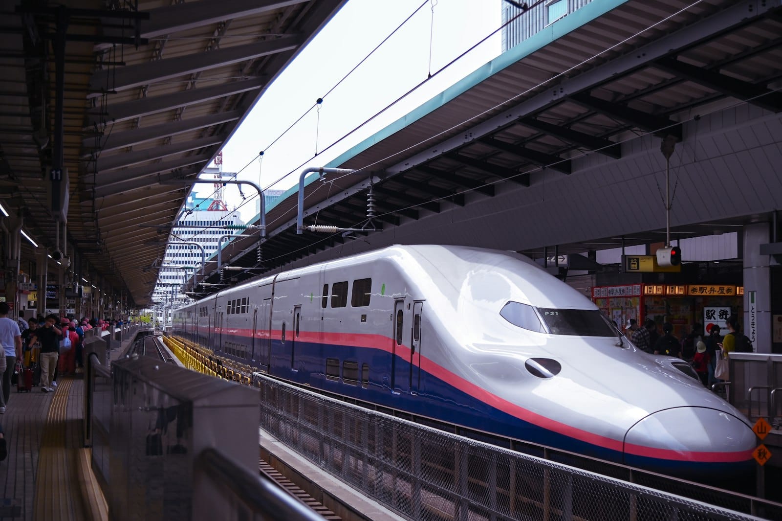 Bullet train shinkansen at platform representing efficient Japanese rail system