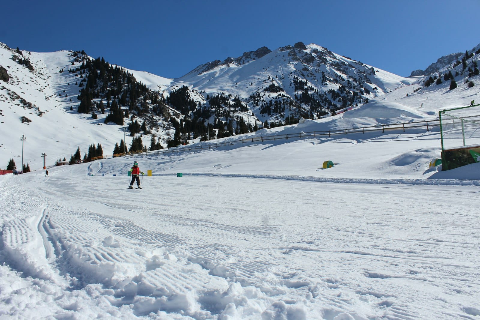 A young skier on the nursery slope at Shymbulak ski resort