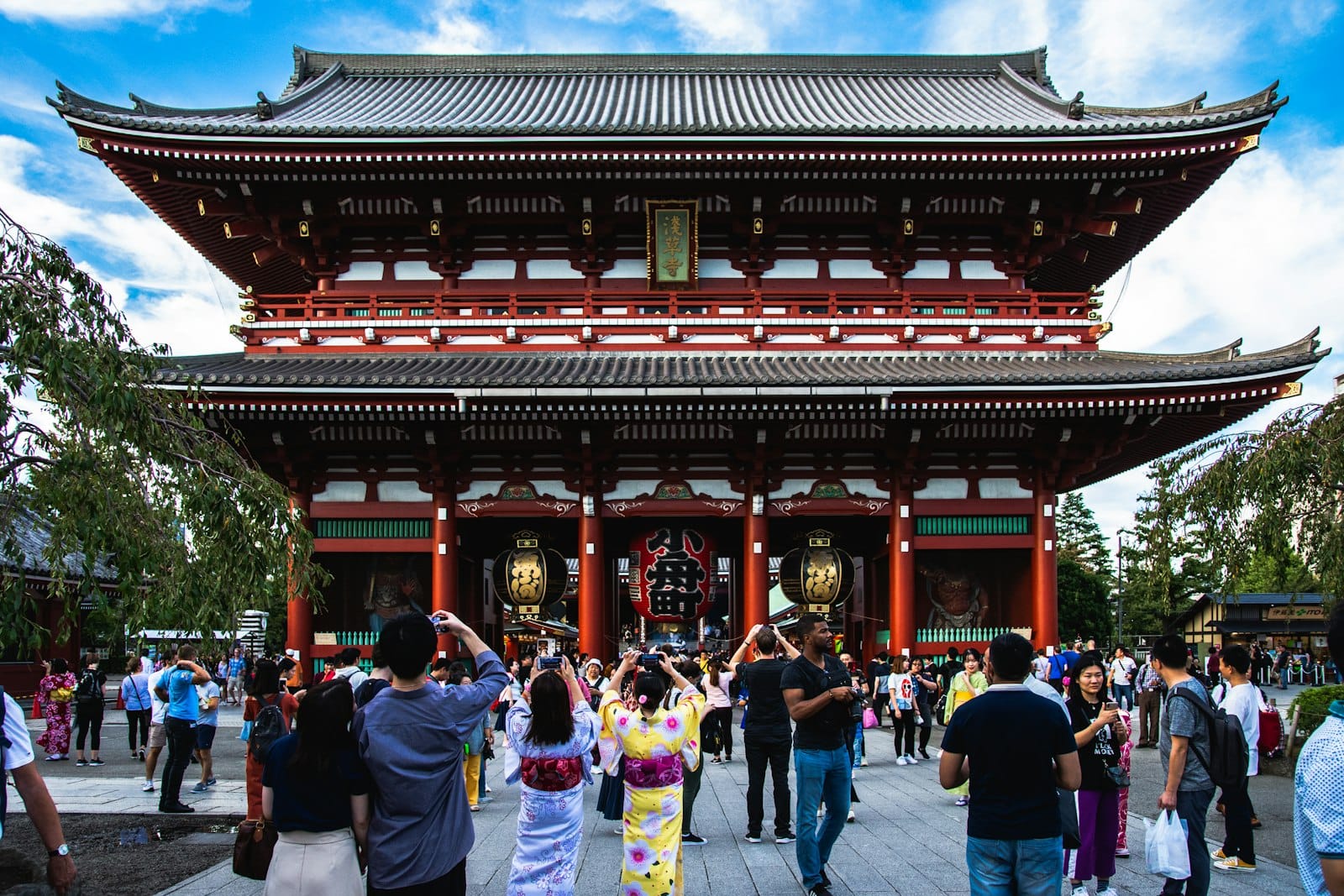 Visitors walking through the Senso-ji temple area in Asakusa