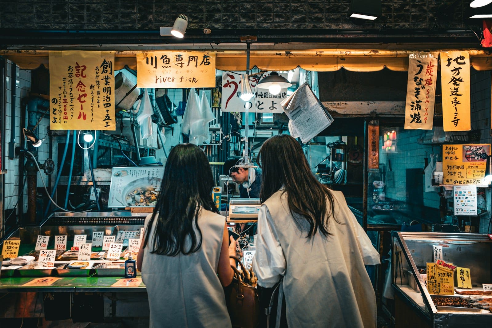 Shoppers at a seafood stall in a Japanese market
