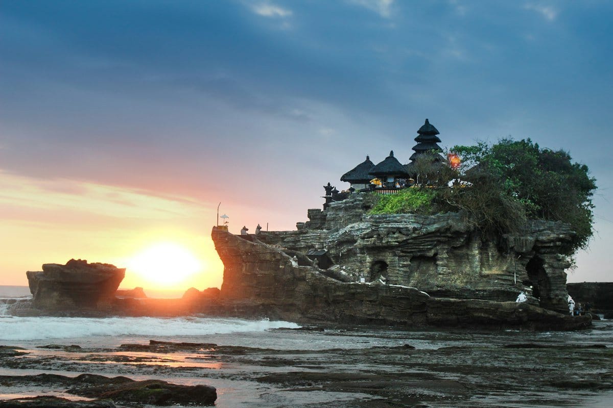 Collage of popular international destinations including temples, beaches, and modern cities