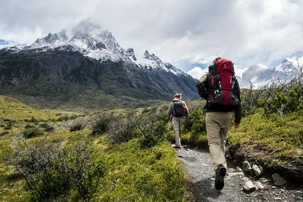 Confident traveler with backpack overlooking scenic international destination
