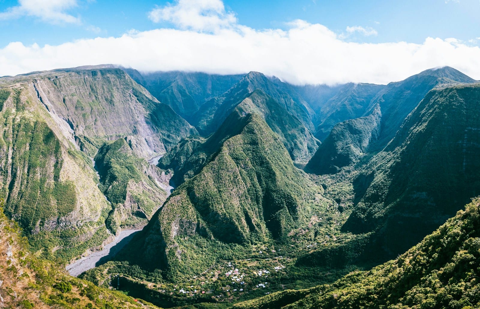 Green volcanic ridges and a deep valley seen from the Belvédère de Bois Court viewpoint in Réunion