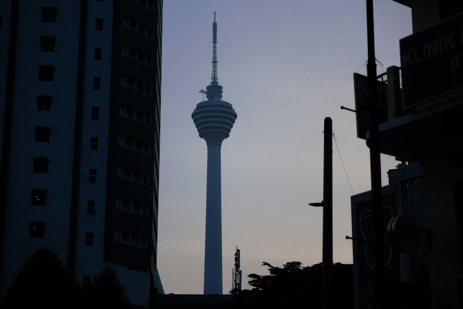 Aerial view of Kuala Lumpur city from KL Tower observation deck showing urban landscape.